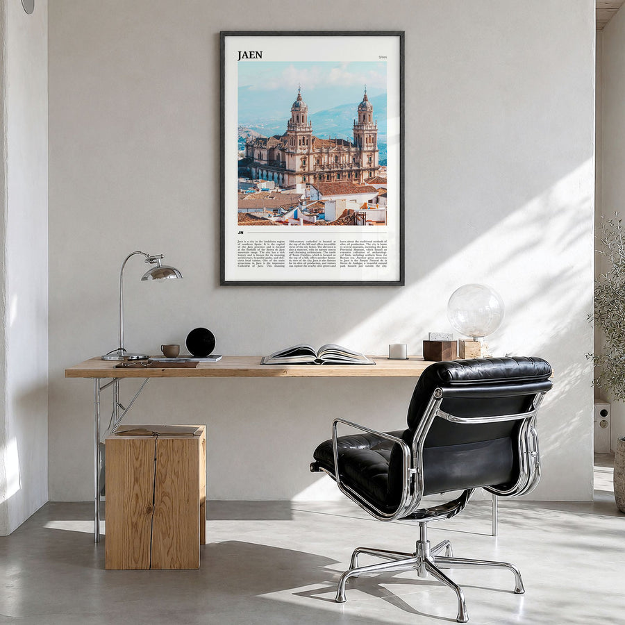 Jaén Travel Poster in a black wood frame, hanging in a bright home office
