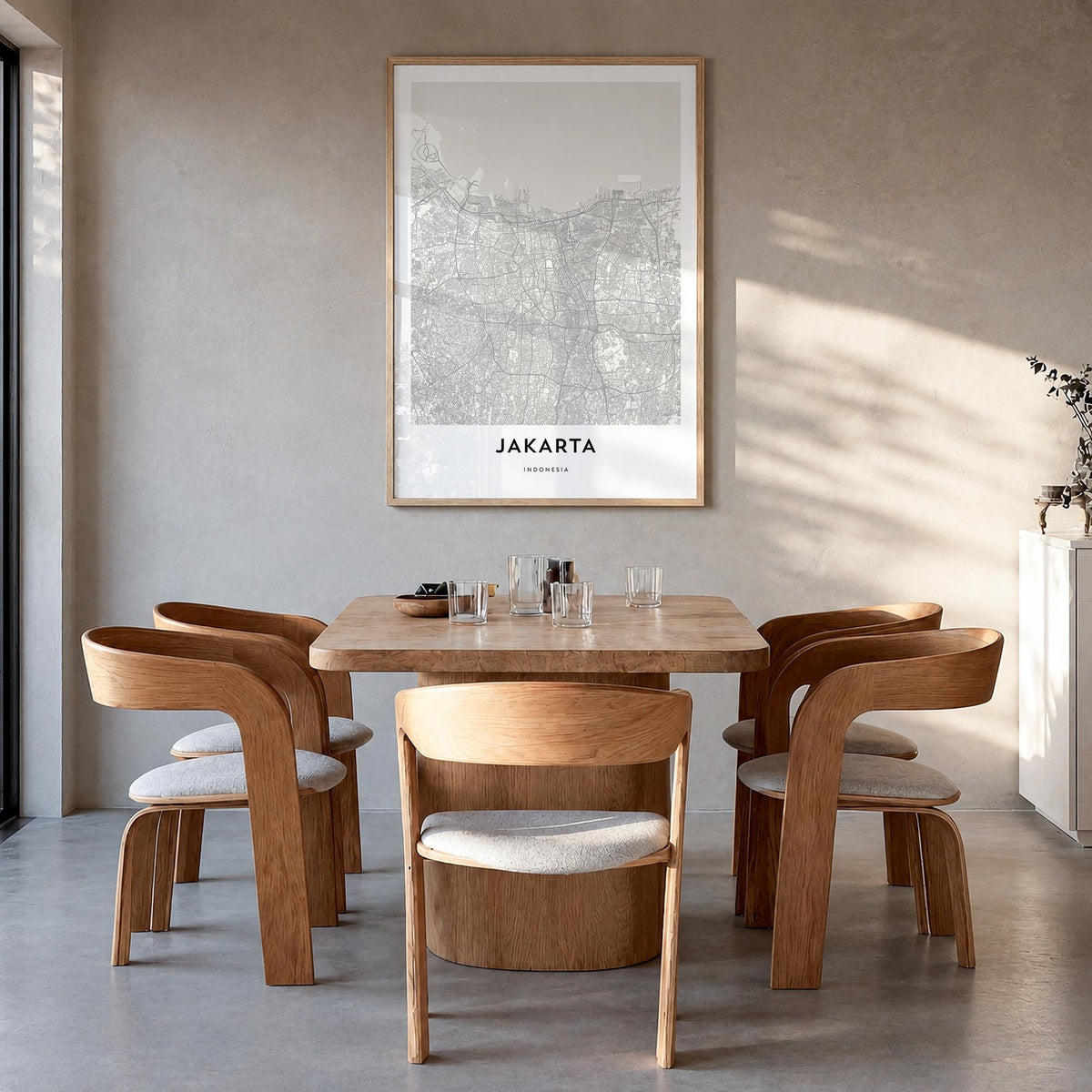 Jakarta black & white map poster of Indonesia – vertical wall art in natural wood frame, hanging on wall