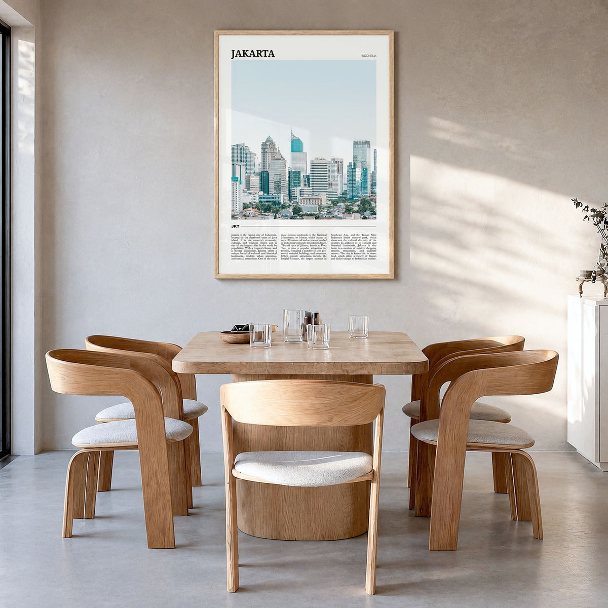 Jakarta Travel Poster in a natural wood frame, hanging in a dining room