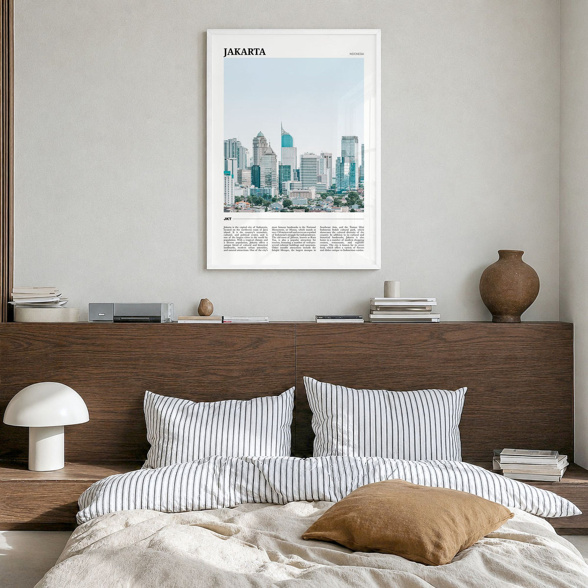 Jakarta Travel Poster in a white wood frame, hanging in a bedroom