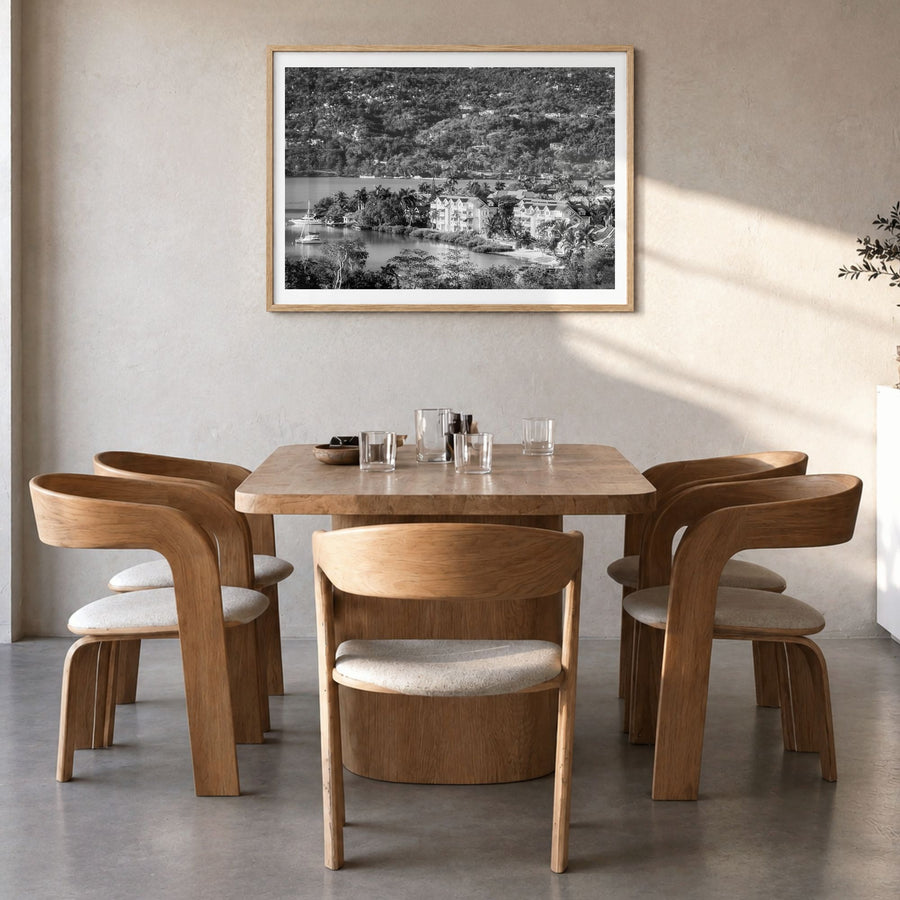 Jamaica Photo Poster in a natural wood frame, hanging in a dining room, white border