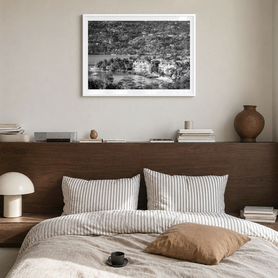 Jamaica Photo Poster in a white wood frame, hanging in a bedroom, white border
