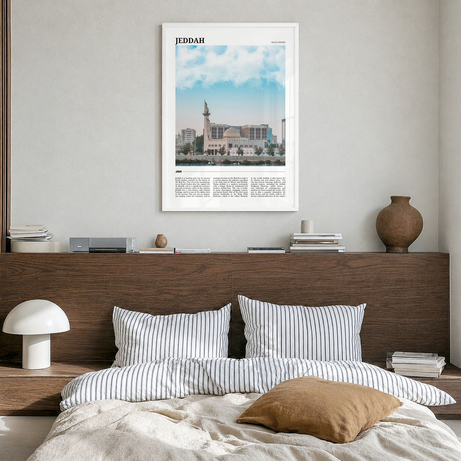 Jeddah Travel Poster in a white wood frame, hanging in a bedroom