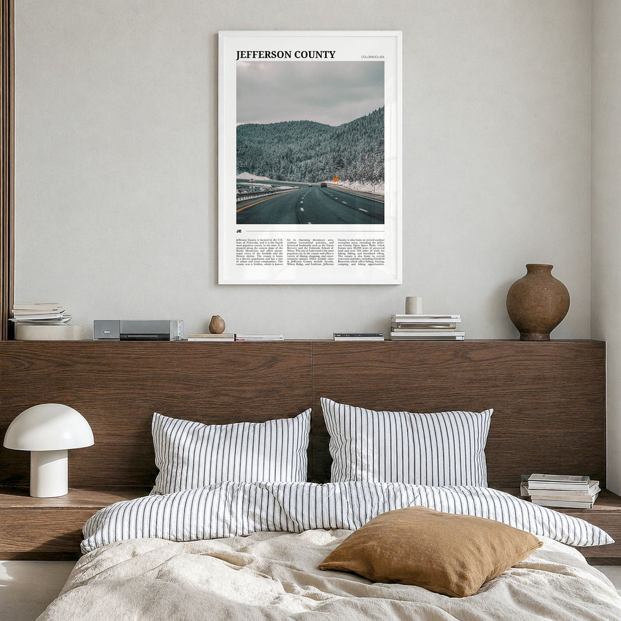 Jefferson County Travel Poster in a white wood frame, hanging in a bedroom