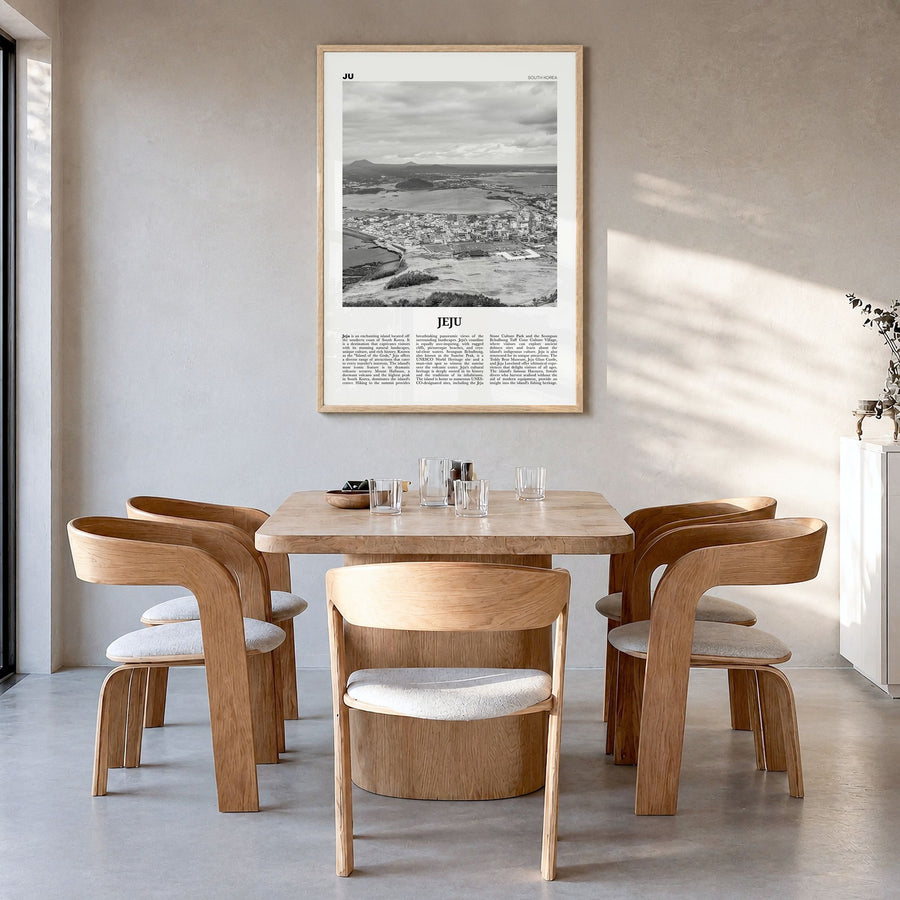 Jeju City Newspaper Poster in a natural wood frame, hanging in a dining room