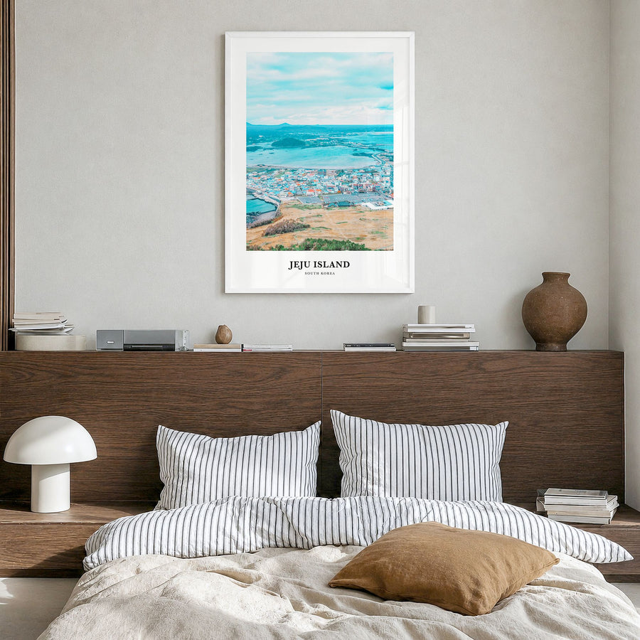 Jeju Island Classic Poster in a white wood frame, hanging in a bedroom