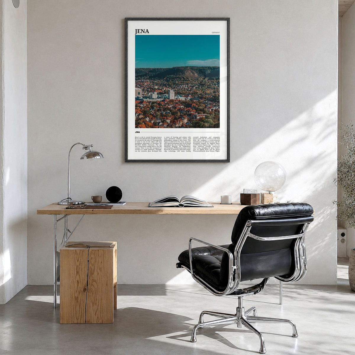 Jena Travel Poster in a black wood frame, hanging in a bright home office