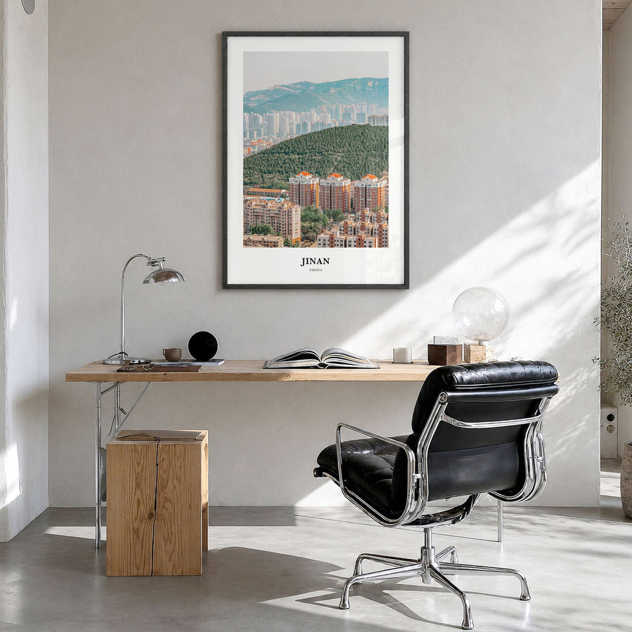 Jinan Classic Poster in a black wood frame, hanging in a bright home office