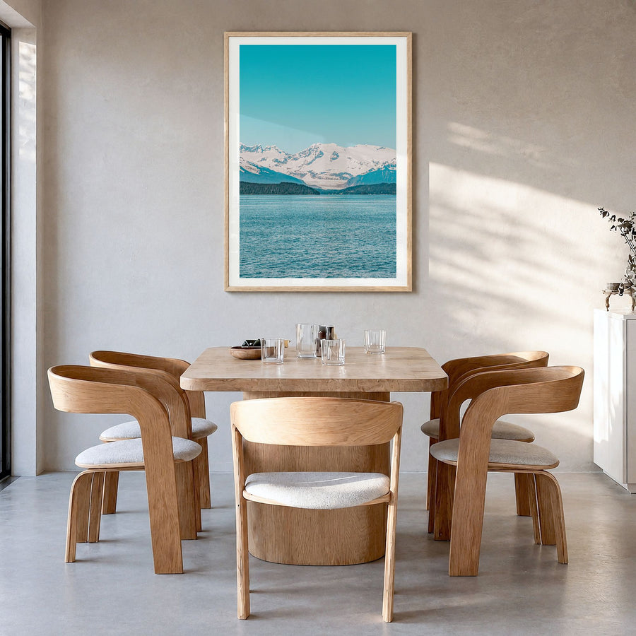 Juneau Photo Poster in a natural wood frame, hanging in a dining room, white border