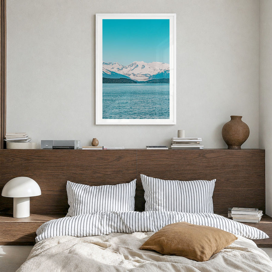 Juneau Photo Poster in a white wood frame, hanging in a bedroom, white border