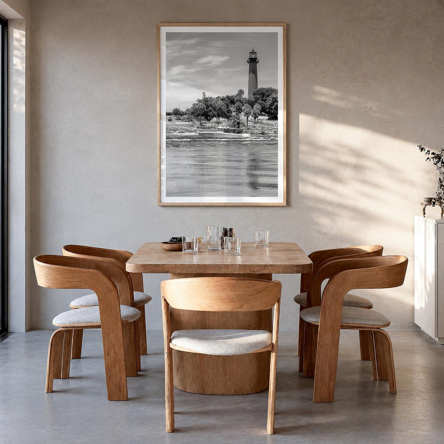 Jupiter black & white photo poster of Florida, USA – vertical wall art in natural wood frame with white border, hanging on wa
