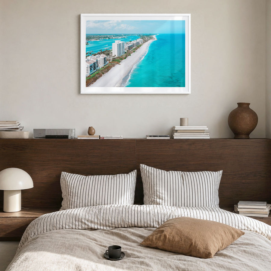 Jupiter Photo Poster in a white wood frame, hanging in a bedroom, white border