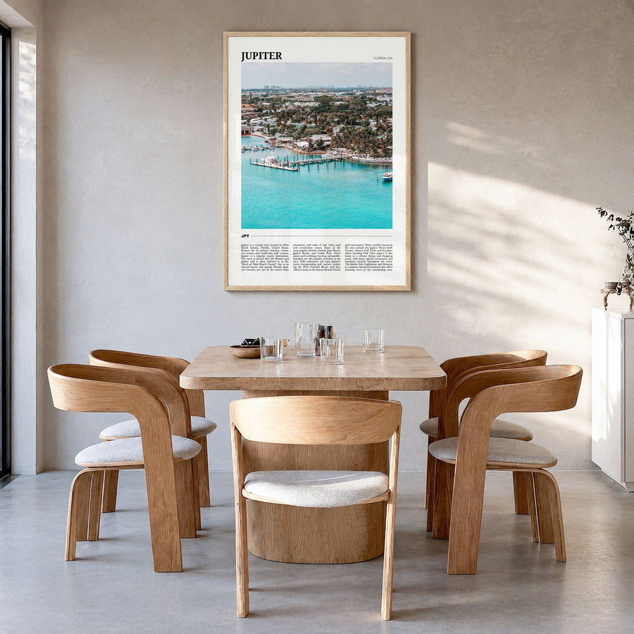 Jupiter Travel Poster in a natural wood frame, hanging in a dining room