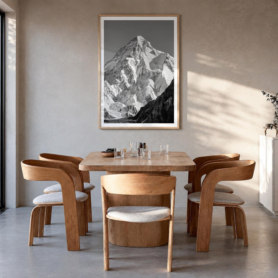K2 black & white photo poster of Pakistan & China – vertical wall art in natural wood frame with white border, hanging on wal