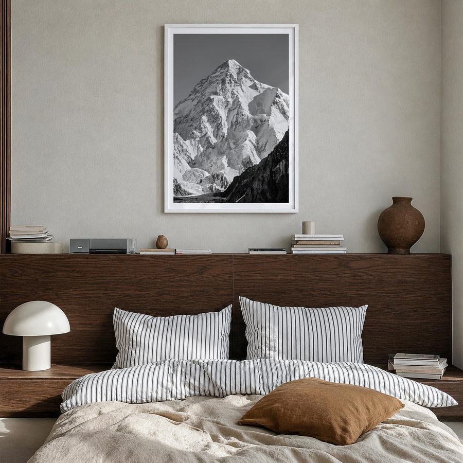K2 black & white photo poster of Pakistan & China – vertical wall art in white wood frame with white border, hanging on wall