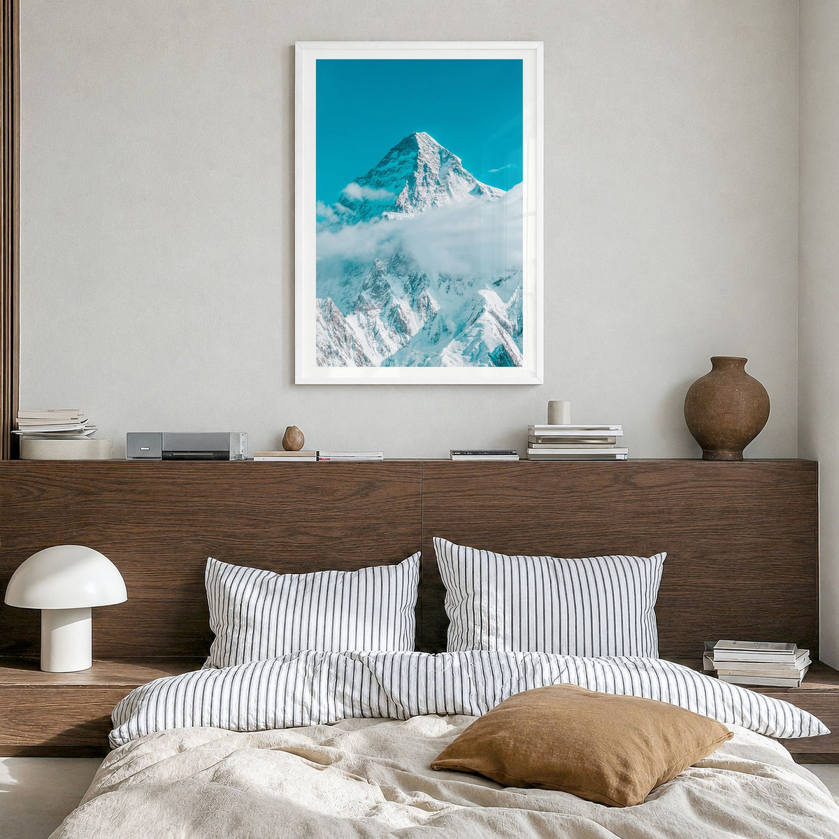 K2 Photo Poster in a white wood frame, hanging in a bedroom, white border