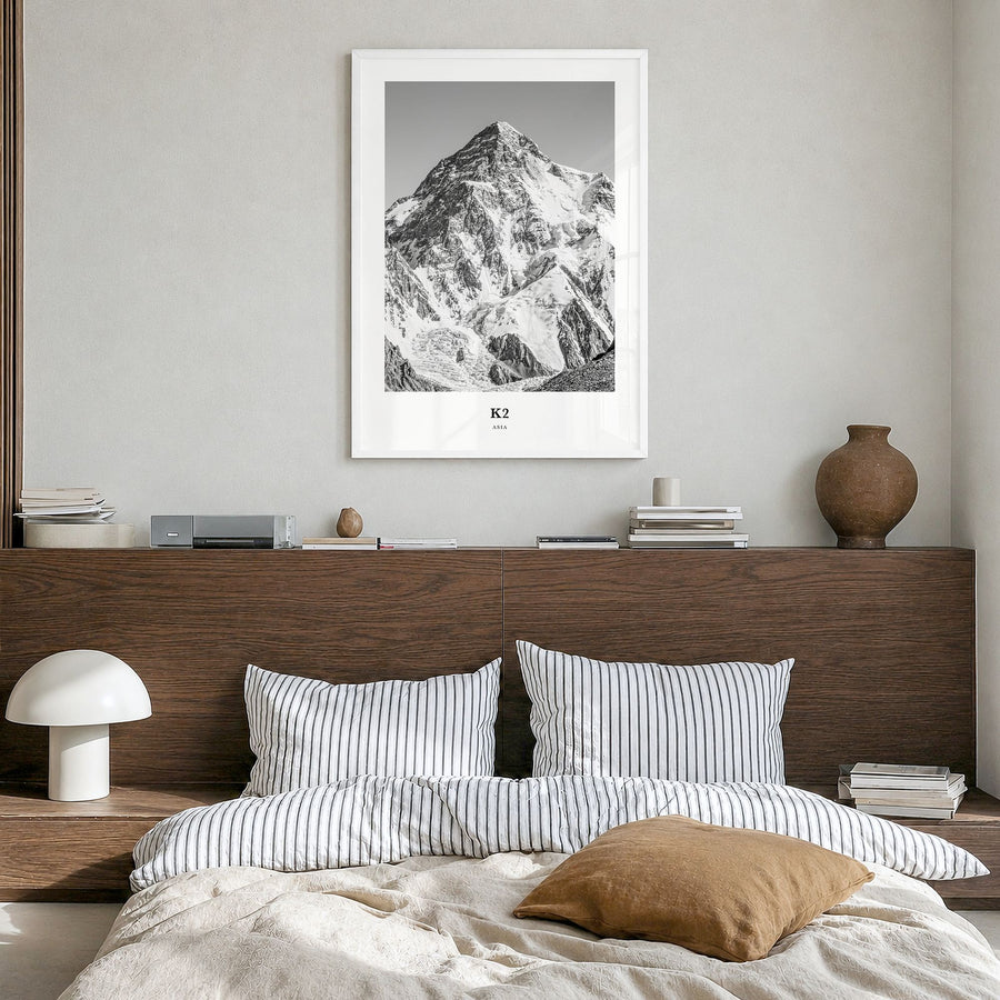 K2 Classic Poster in a white wood frame, hanging in a bedroom