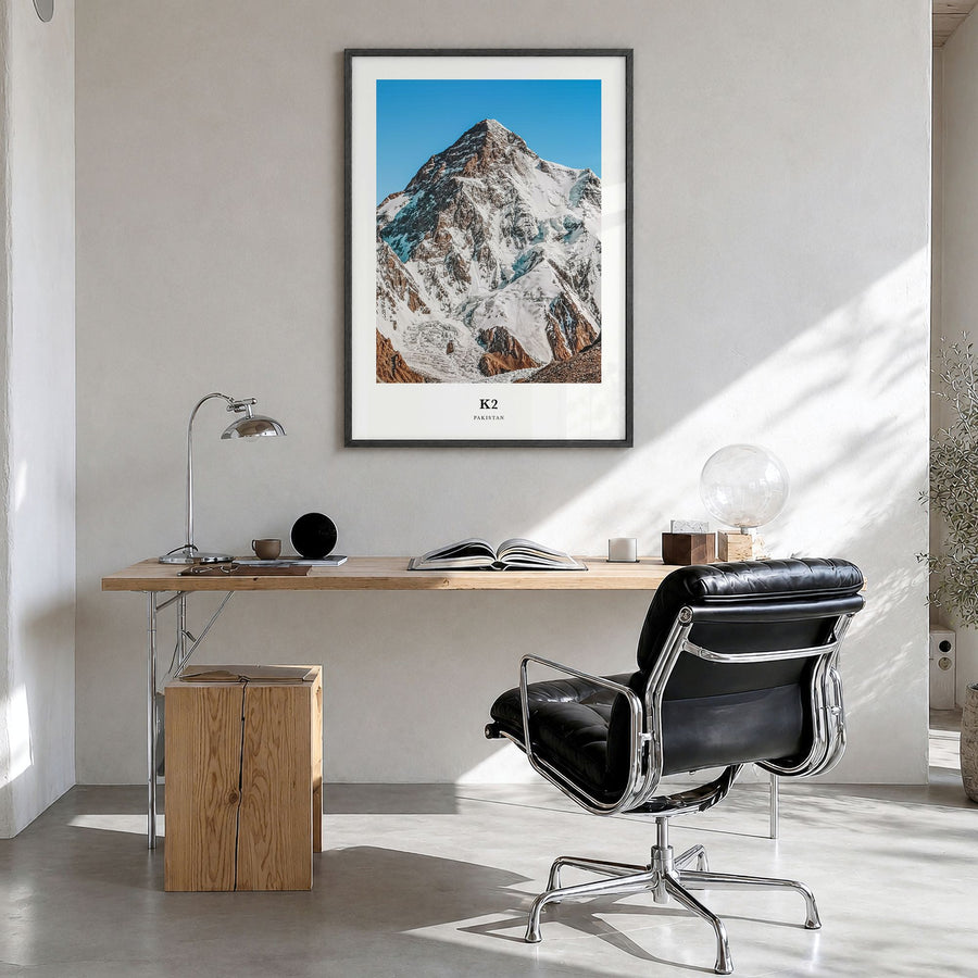 K2 Classic Poster in a black wood frame, hanging in a bright home office