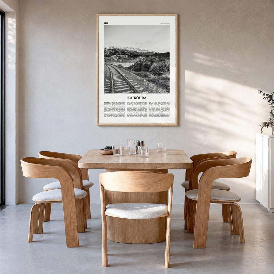 Kaikōura Newspaper Poster in a natural wood frame, hanging in a dining room