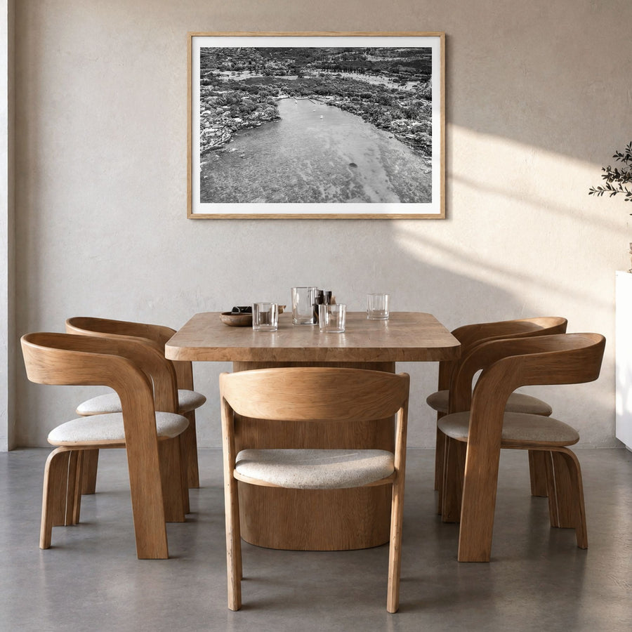 Kailua-Kona Photo Poster in a natural wood frame, hanging in a dining room, white border