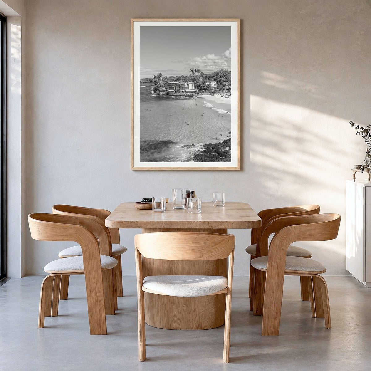 Kailua-Kona Photo Poster in a natural wood frame, hanging in a dining room, white border
