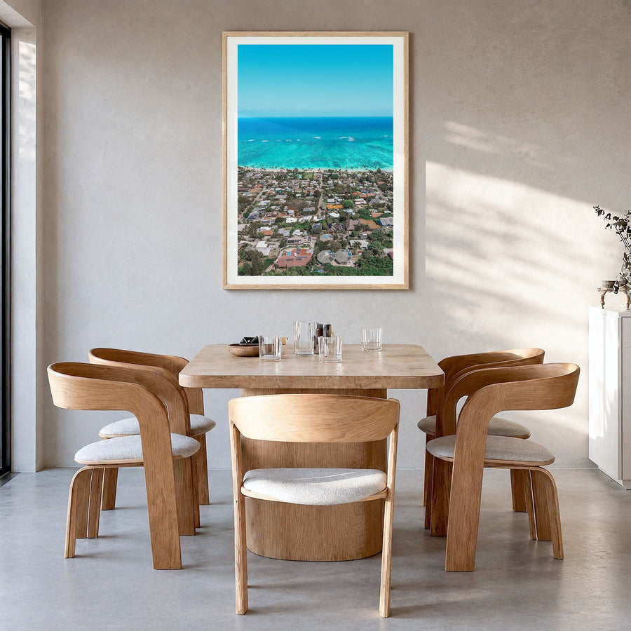 Kailua, Oahu Photo Poster in a natural wood frame, hanging in a dining room, white border