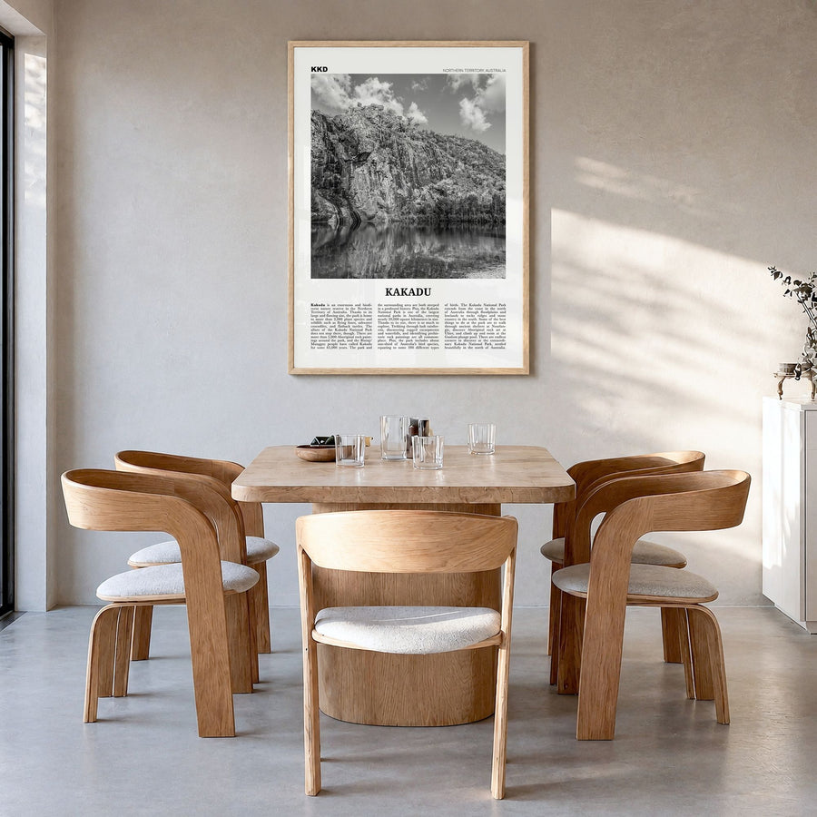 Kakadu Newspaper Poster in a natural wood frame, hanging in a dining room