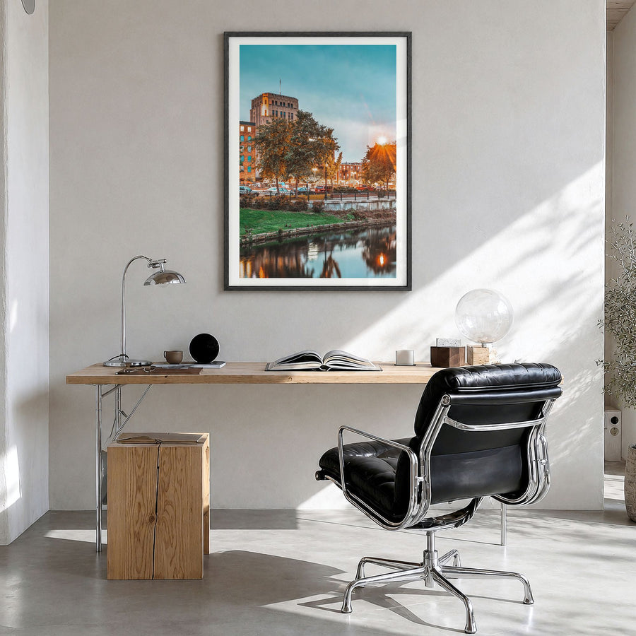 Kalamazoo Photo Poster in a black wood frame, hanging in a bright home office, white border