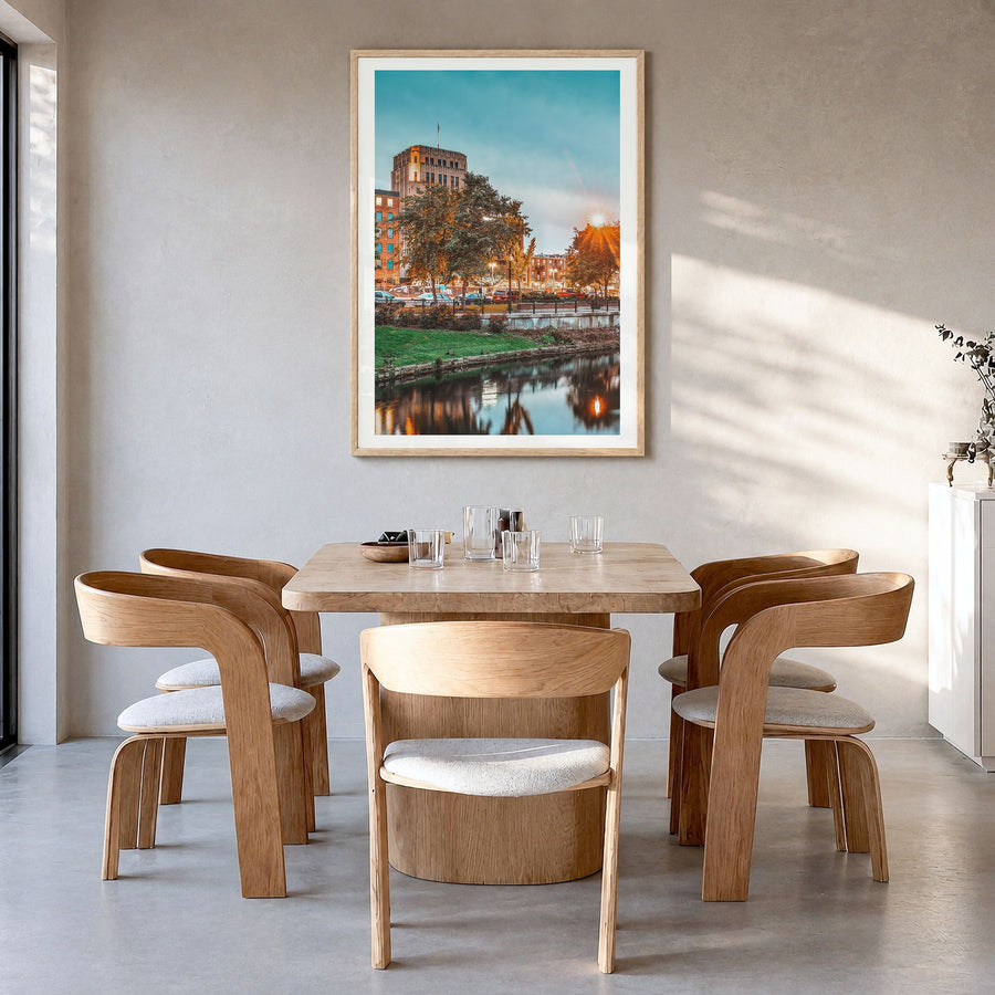 Kalamazoo Photo Poster in a natural wood frame, hanging in a dining room, white border