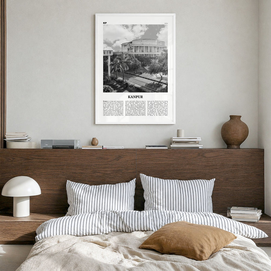 Kanpur Newspaper Poster in a white wood frame, hanging in a bedroom