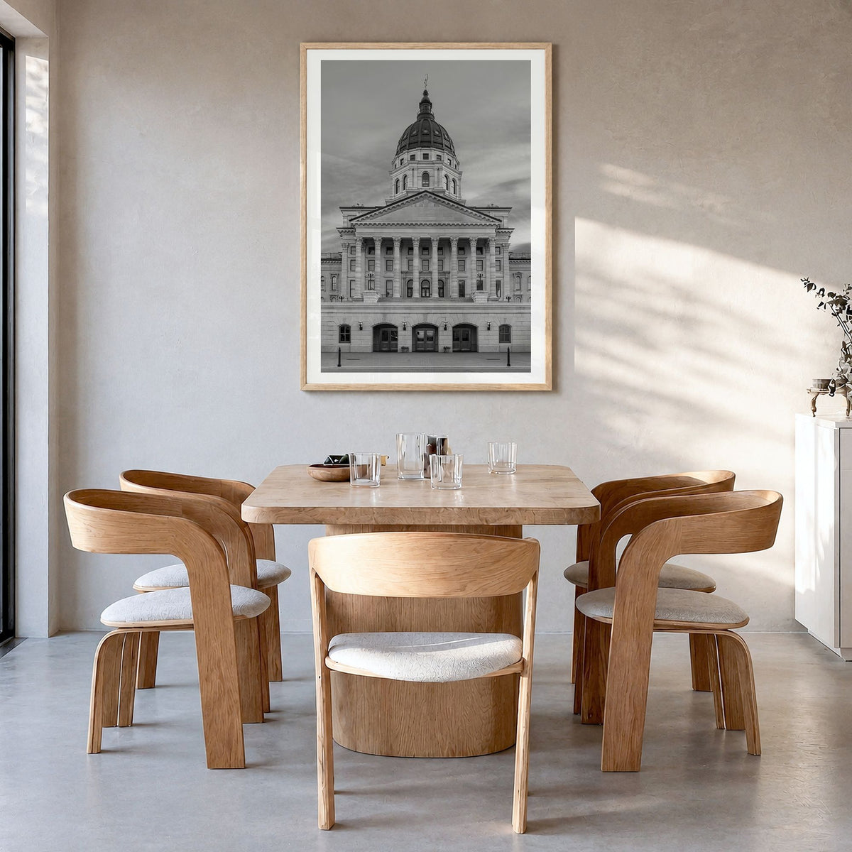 Kansas Photo Poster in a natural wood frame, hanging in a dining room, white border
