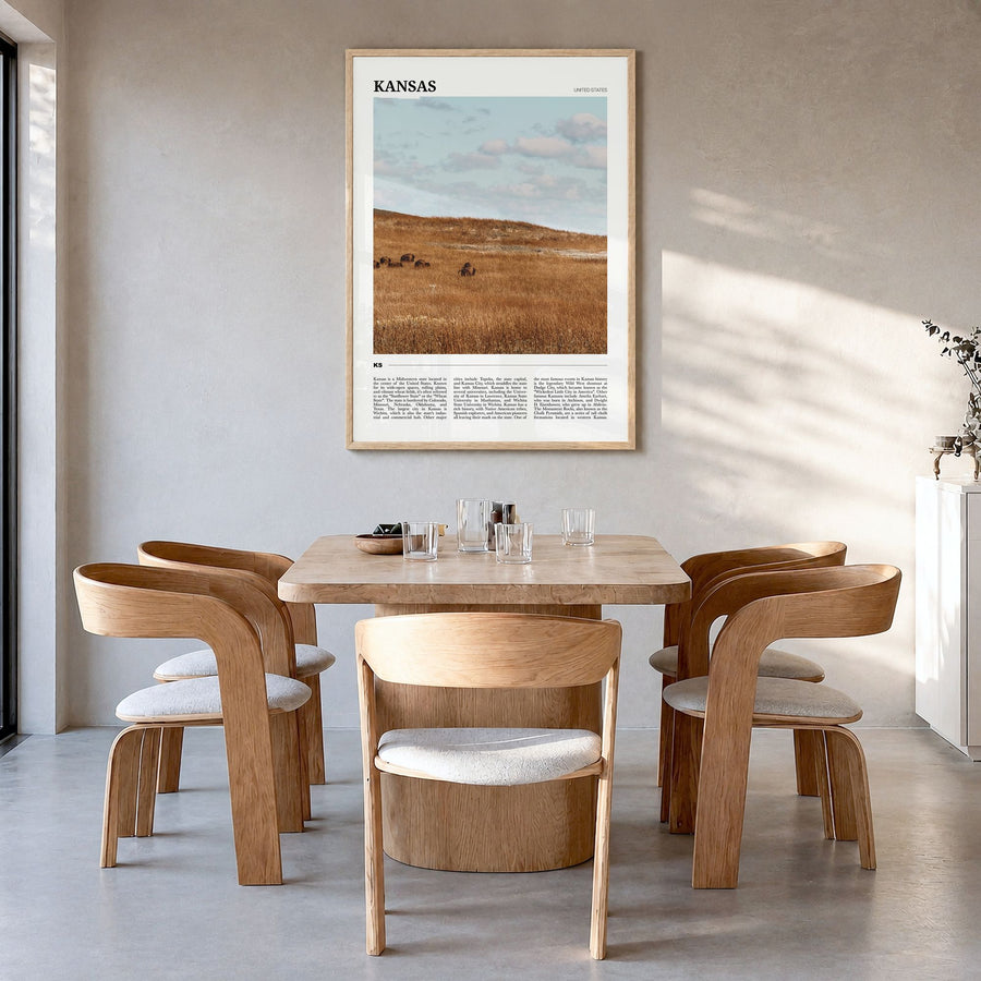 Kansas Travel Poster in a natural wood frame, hanging in a dining room