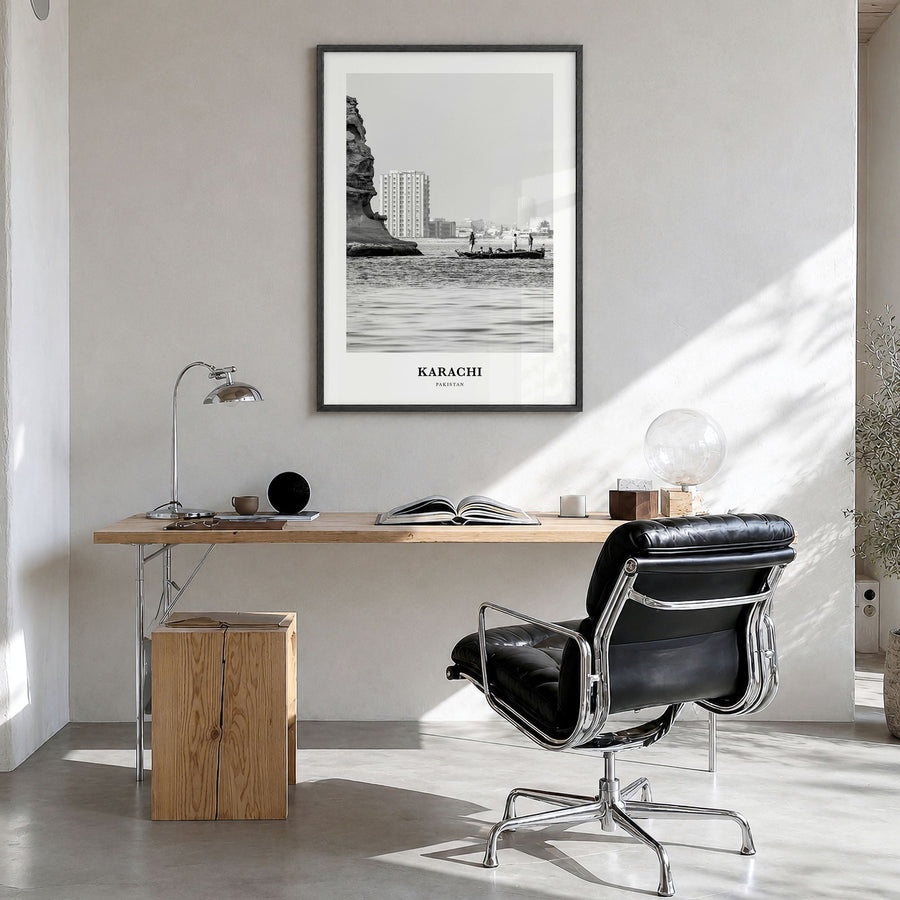 Karachi Classic Poster in a black wood frame, hanging in a bright home office