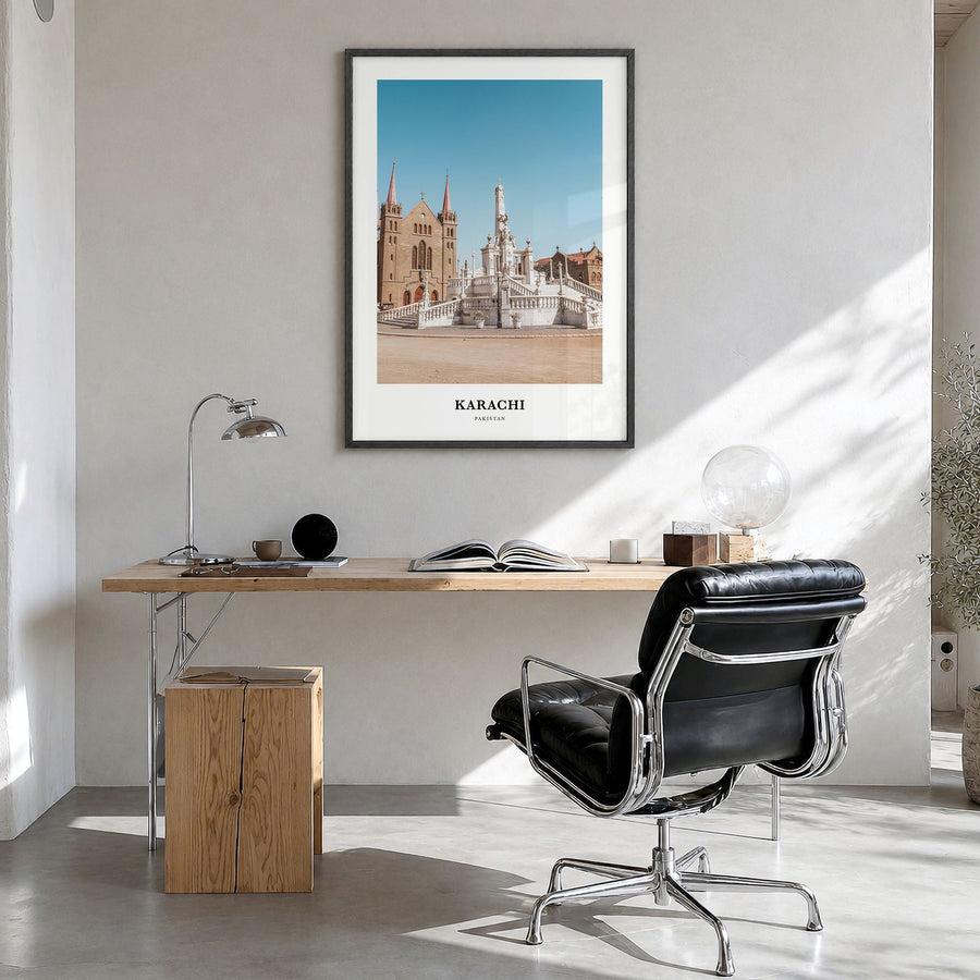 Karachi Classic No 1 Poster in a black wood frame, hanging in a bright home office