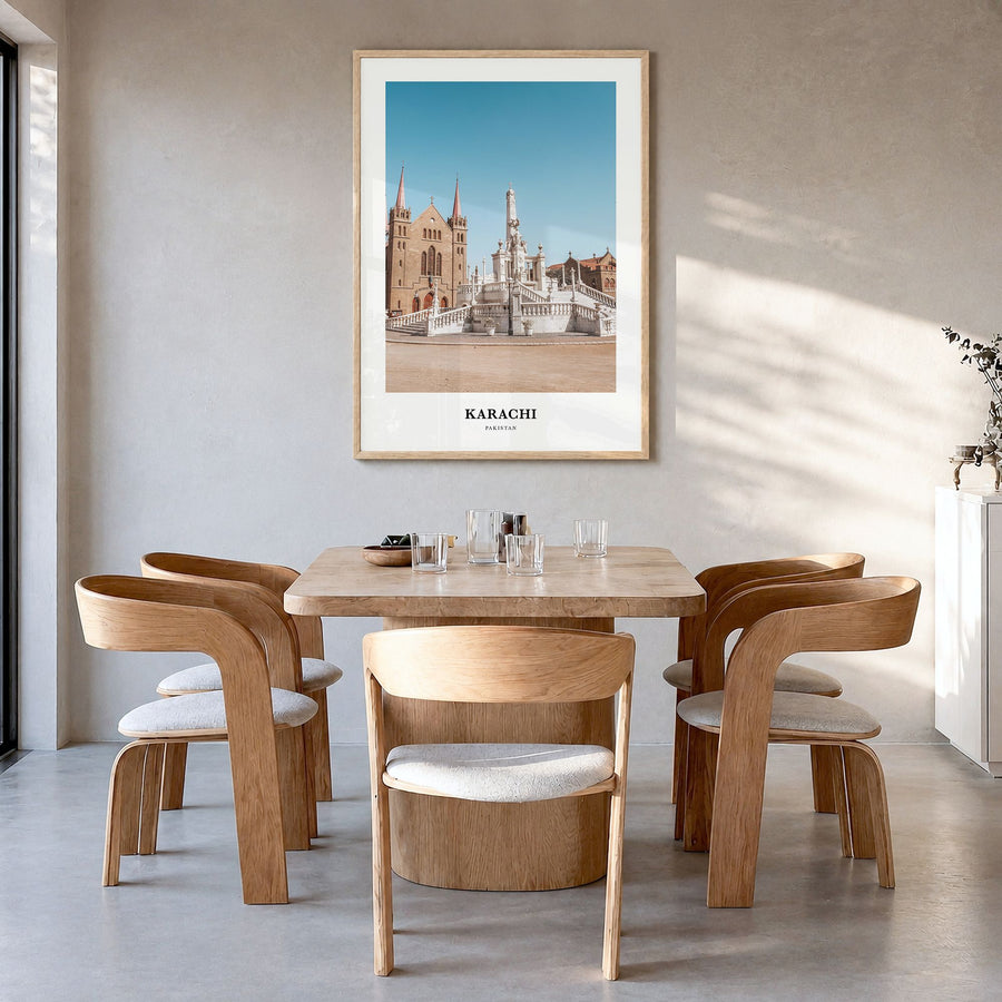 Karachi Classic No 1 Poster in a natural wood frame, hanging in a dining room
