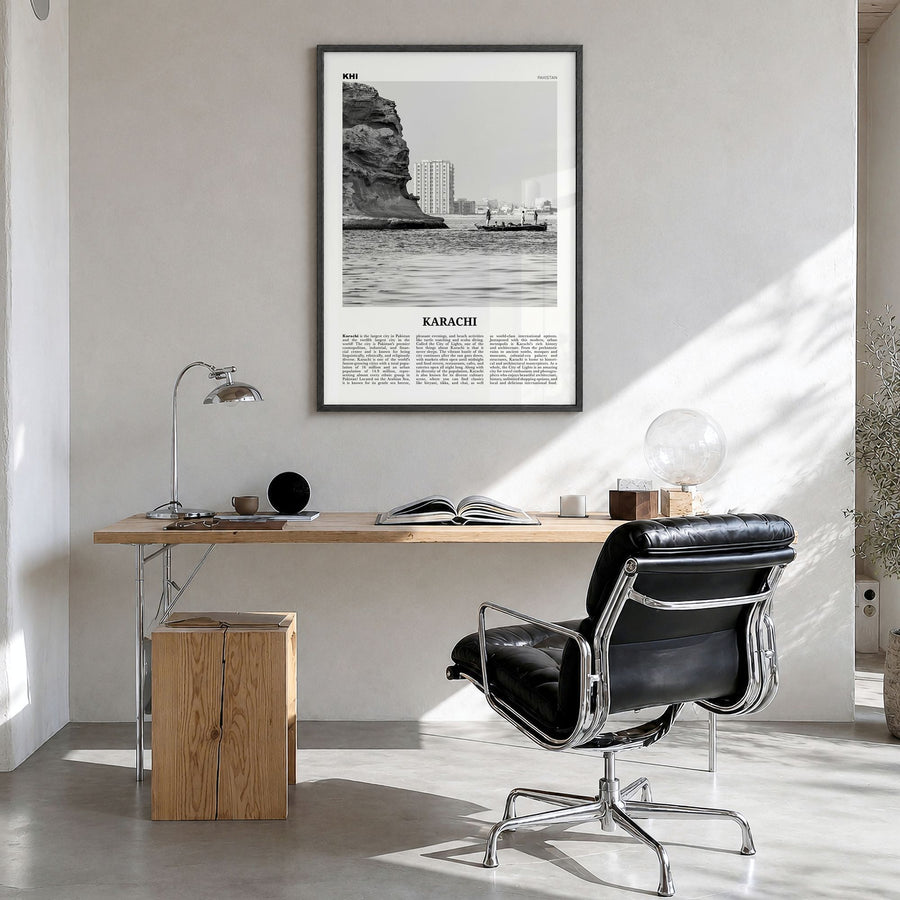 Karachi Newspaper No 1 Poster in a black wood frame, hanging in a bright home office
