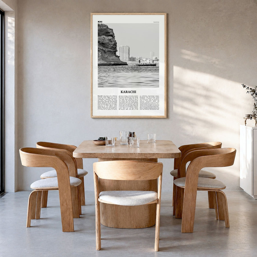 Karachi Newspaper No 1 Poster in a natural wood frame, hanging in a dining room