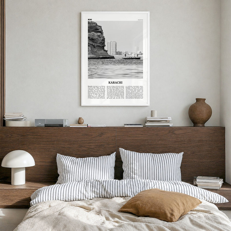 Karachi Newspaper No 1 Poster in a white wood frame, hanging in a bedroom