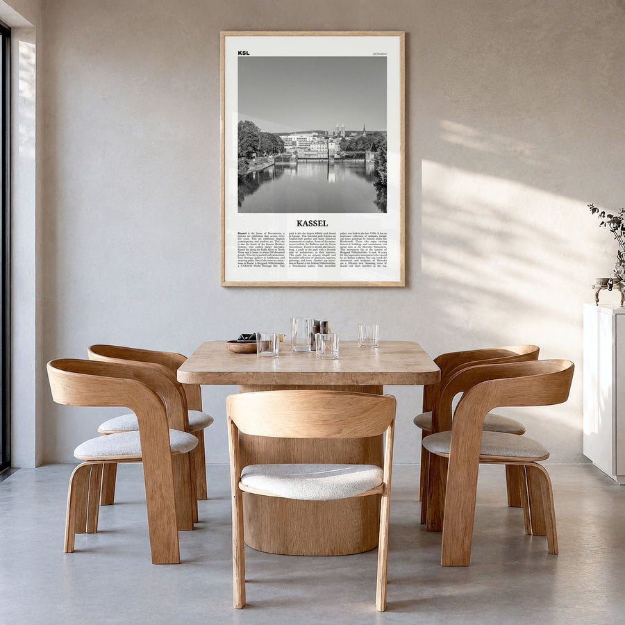 Kassel Newspaper Poster in a natural wood frame, hanging in a dining room