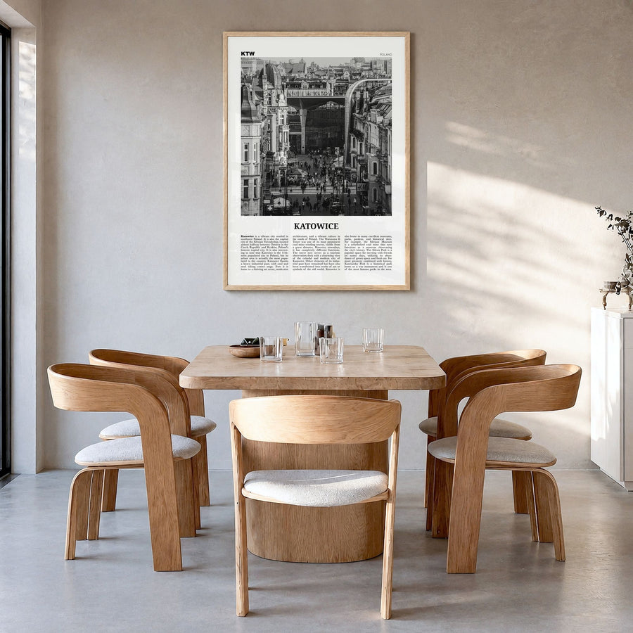Katowice Newspaper Poster in a natural wood frame, hanging in a dining room