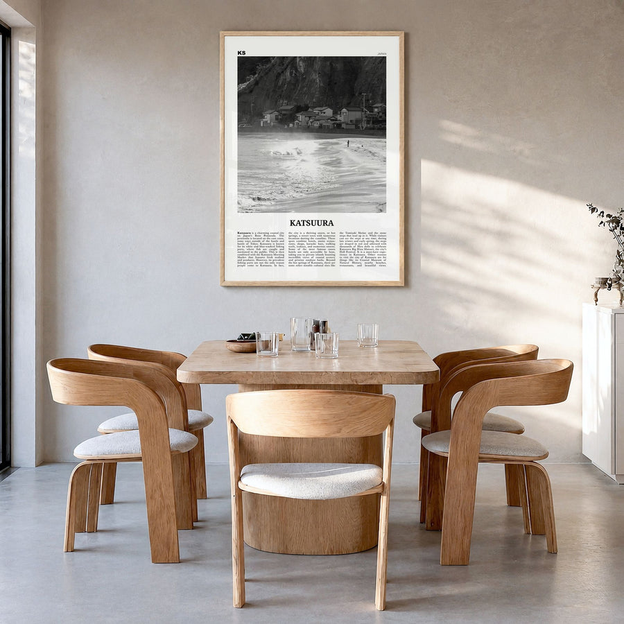 Katsuura Newspaper Poster in a natural wood frame, hanging in a dining room