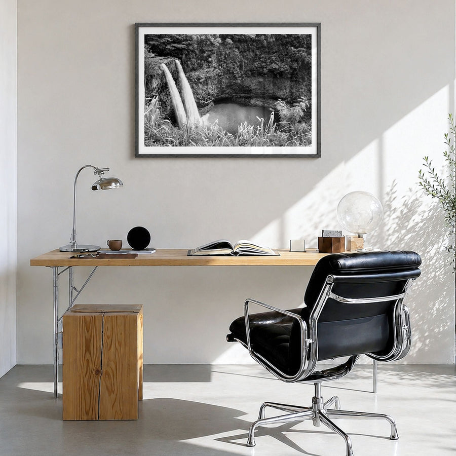 Kauai Photo Poster in a black wood frame, hanging in a bright home office, white border