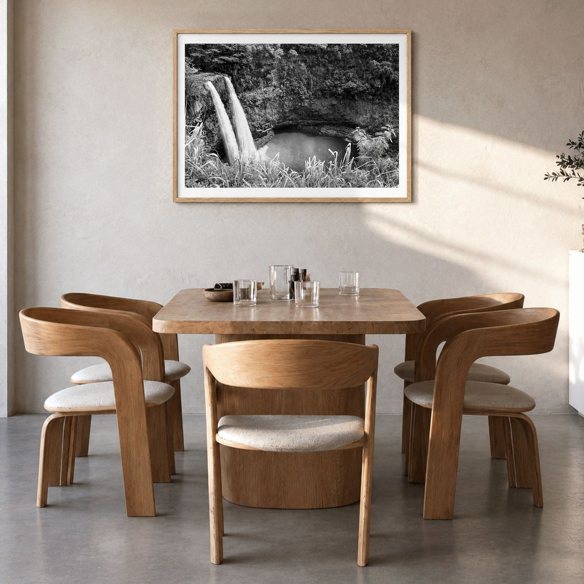 Kauai Photo Poster in a natural wood frame, hanging in a dining room, white border