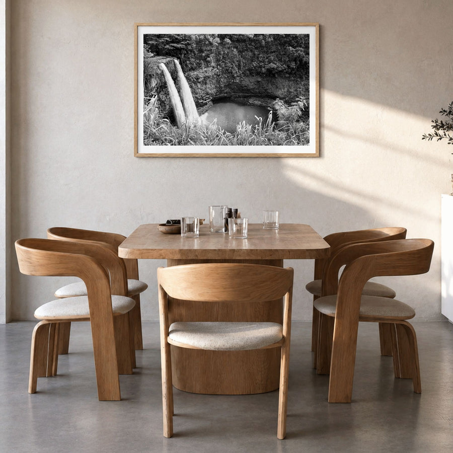 Kauai Photo Poster in a natural wood frame, hanging in a dining room, white border