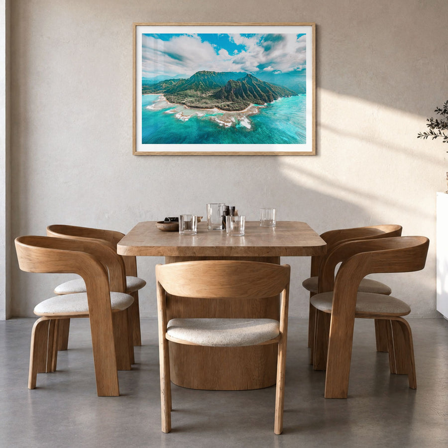 Kauai Photo Poster in a natural wood frame, hanging in a dining room, white border