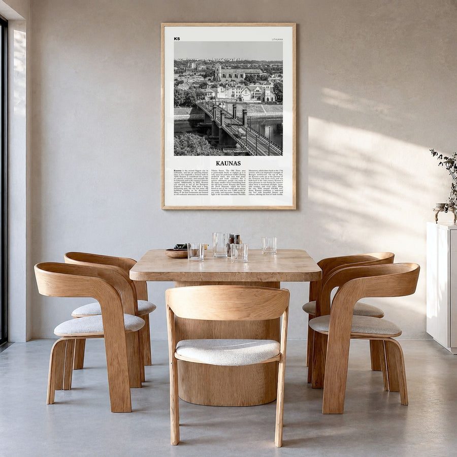 Kaunas Newspaper Poster in a natural wood frame, hanging in a dining room