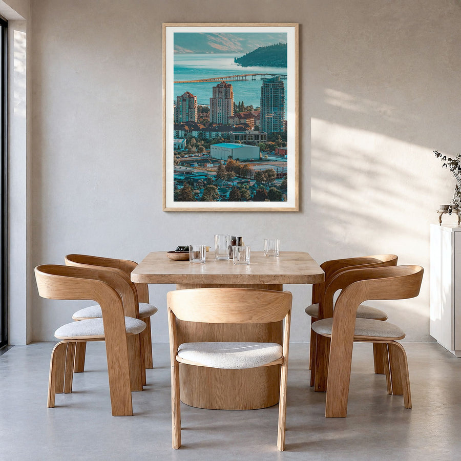 Kelowna Photo Poster in a natural wood frame, hanging in a dining room, white border