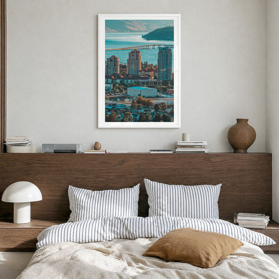 Kelowna Photo Poster in a white wood frame, hanging in a bedroom, white border