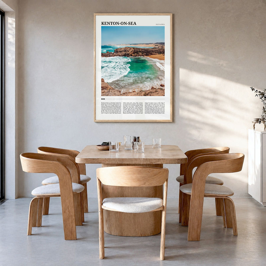 Kenton-on-Sea Travel Poster in a natural wood frame, hanging in a dining room