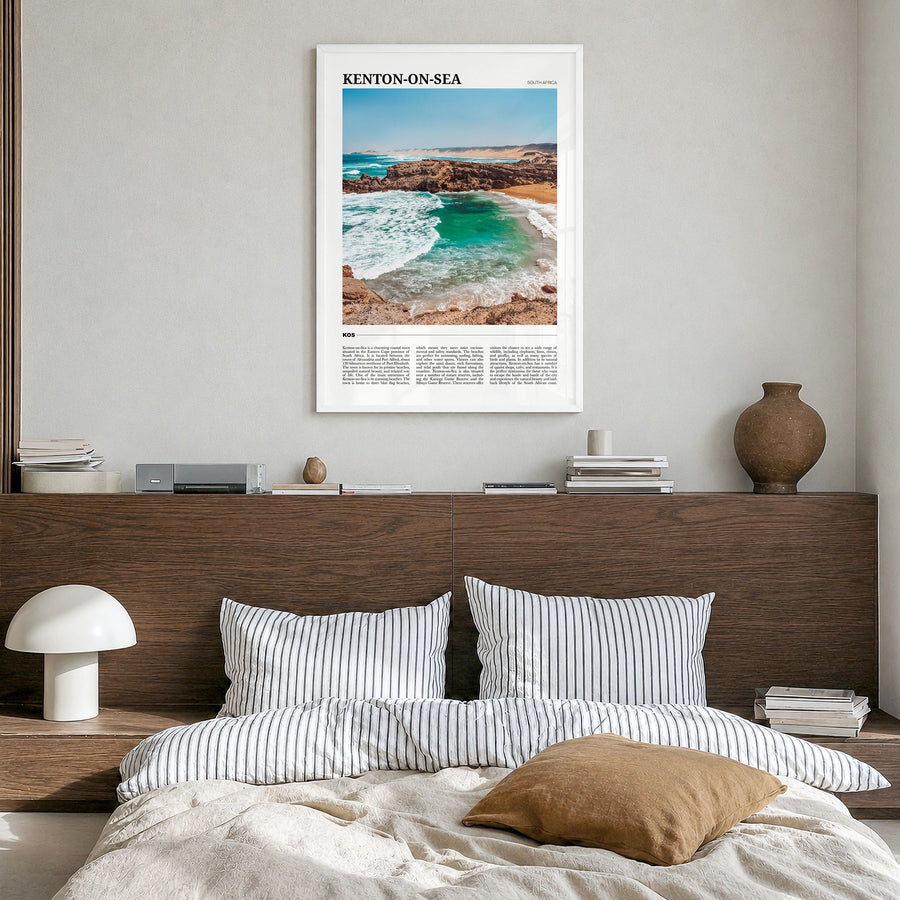 Kenton-on-Sea Travel Poster in a white wood frame, hanging in a bedroom